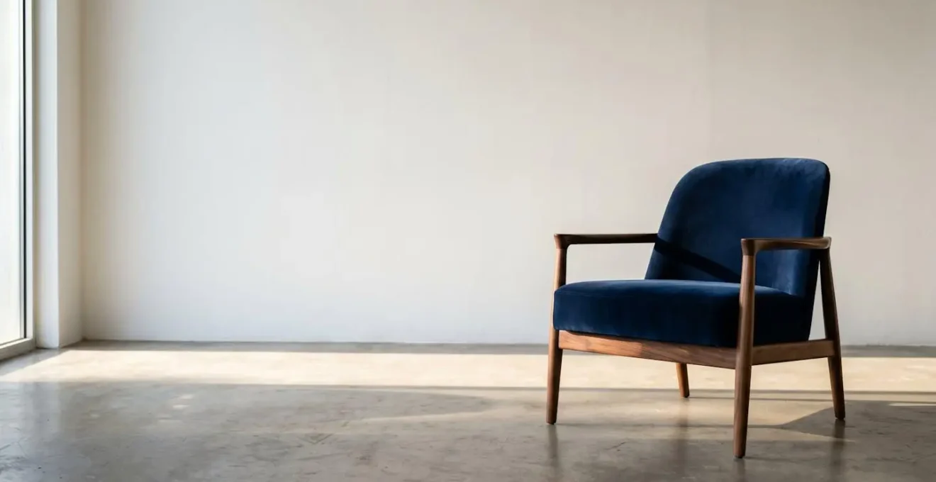 Elegant velvet armchair with walnut wood frame showing material contrast
